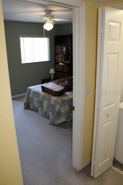 9722 Indian Key Trl Unit 116, Seminole, FL 33776 - carpeted bedroom with baseboards and ceiling fan