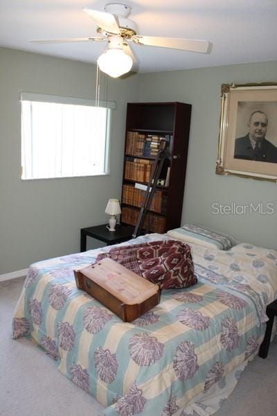 9722 Indian Key Trl Unit 116, Seminole, FL 33776 - bedroom with carpet and a ceiling fan
