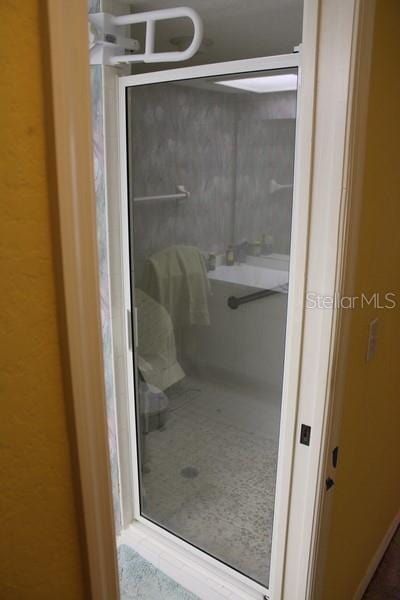 9722 Indian Key Trl Unit 116, Seminole, FL 33776 - bathroom featuring a shower stall