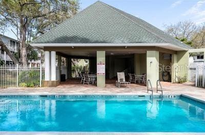 9722 Indian Key Trl Unit 116, Seminole, FL 33776 - community pool featuring a gazebo and a patio area