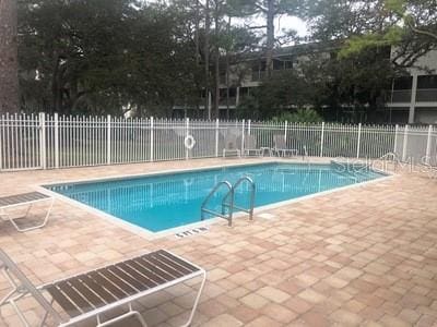 9722 Indian Key Trl Unit 116, Seminole, FL 33776 - community pool with a patio