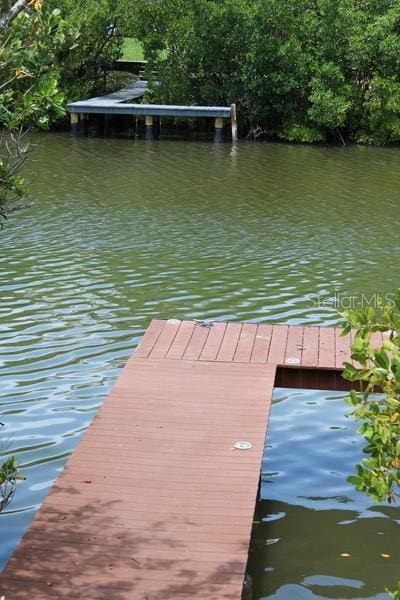 9722 Indian Key Trl Unit 116, Seminole, FL 33776 - dock area featuring a water view