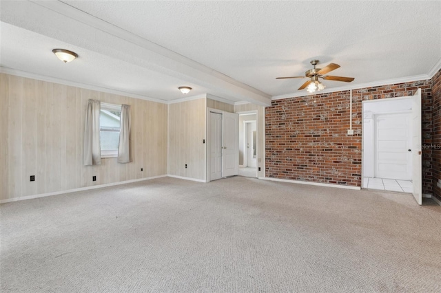 1212 Blake Ave, Auburndale, FL 33823 - empty room featuring ceiling fan, ornamental molding, a textured ceiling, light carpet, and baseboards