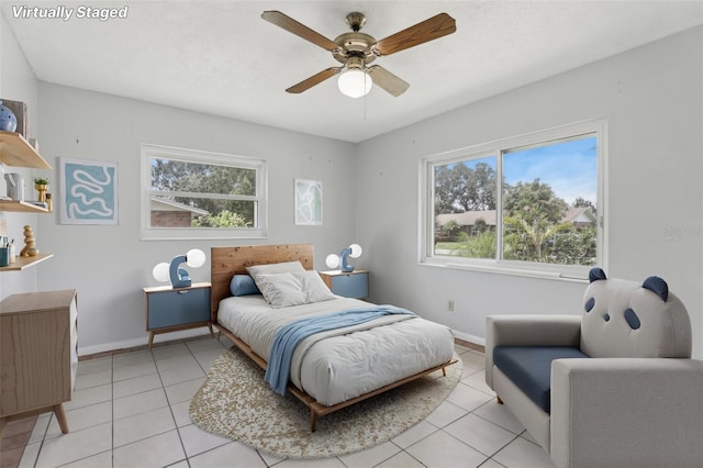 1212 Blake Ave, Auburndale, FL 33823 - bedroom with light tile patterned floors, multiple windows, baseboards, and ceiling fan