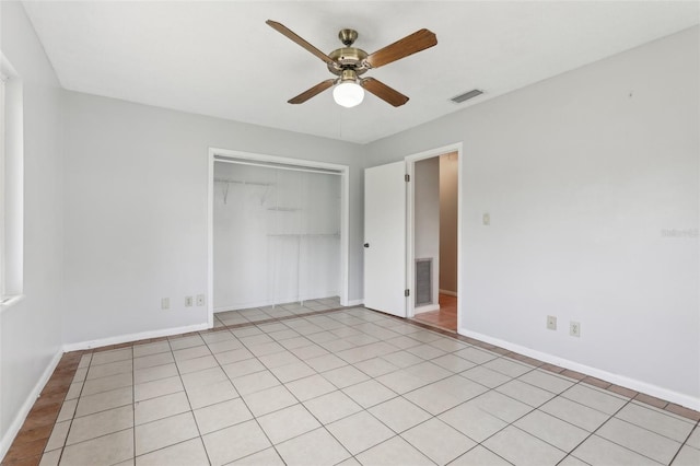 1212 Blake Ave, Auburndale, FL 33823 - unfurnished bedroom featuring a closet, baseboards, and ceiling fan