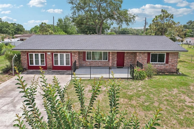 1212 Blake Ave, Auburndale, FL 33823 - single story home with a shingled roof and brick siding