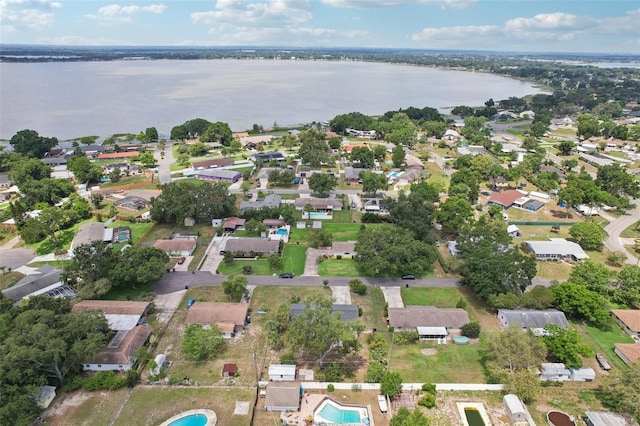 1212 Blake Ave, Auburndale, FL 33823 - aerial view of property and surrounding area featuring a nearby body of water, nearby suburban area, and a pool area