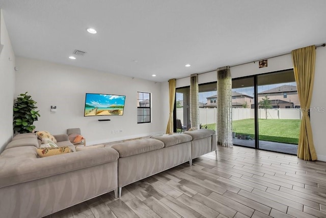 12650 Shetland Walk Dr, Lithia, FL 33547 - living area with plenty of natural light, recessed lighting, and light wood-style floors