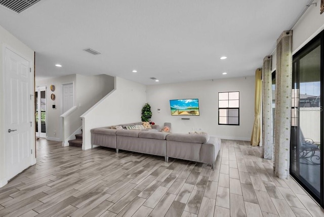 12650 Shetland Walk Dr, Lithia, FL 33547 - living area with light wood-style floors, recessed lighting, baseboards, and stairs
