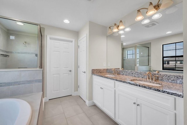 12650 Shetland Walk Dr, Lithia, FL 33547 - bathroom with double vanity, tiled shower, tile patterned floors, a tub, and baseboards