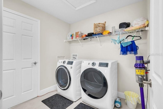 12650 Shetland Walk Dr, Lithia, FL 33547 - washroom with independent washer and dryer, baseboards, attic access, and light tile patterned flooring