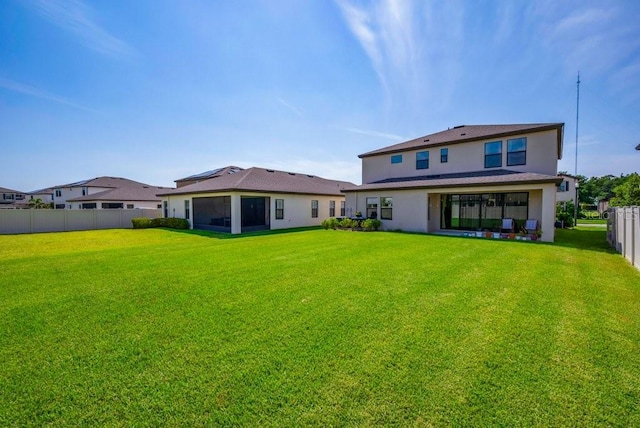 12650 Shetland Walk Dr, Lithia, FL 33547 - back of house featuring a sunroom and stucco siding