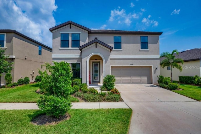 12650 Shetland Walk Dr, Lithia, FL 33547 - traditional home with stucco siding, a garage, concrete driveway, and a front yard