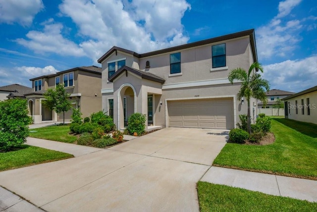 12650 Shetland Walk Dr, Lithia, FL 33547 - traditional-style home featuring stucco siding, a garage, concrete driveway, and a front lawn