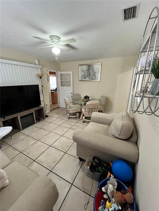 1708 28th St W, Bradenton, FL 34205 - living area featuring light tile patterned flooring and ceiling fan