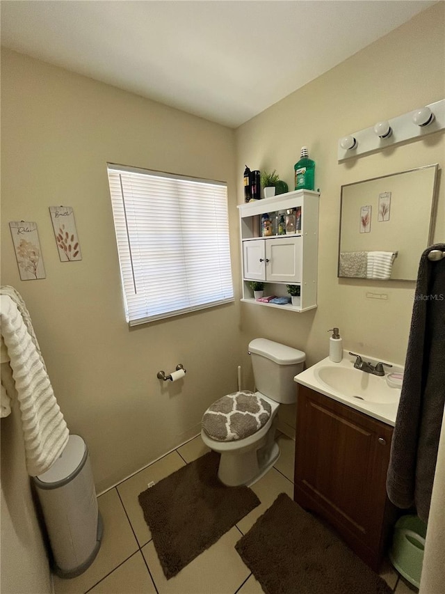 1708 28th St W, Bradenton, FL 34205 - bathroom with toilet, tile patterned floors, and vanity