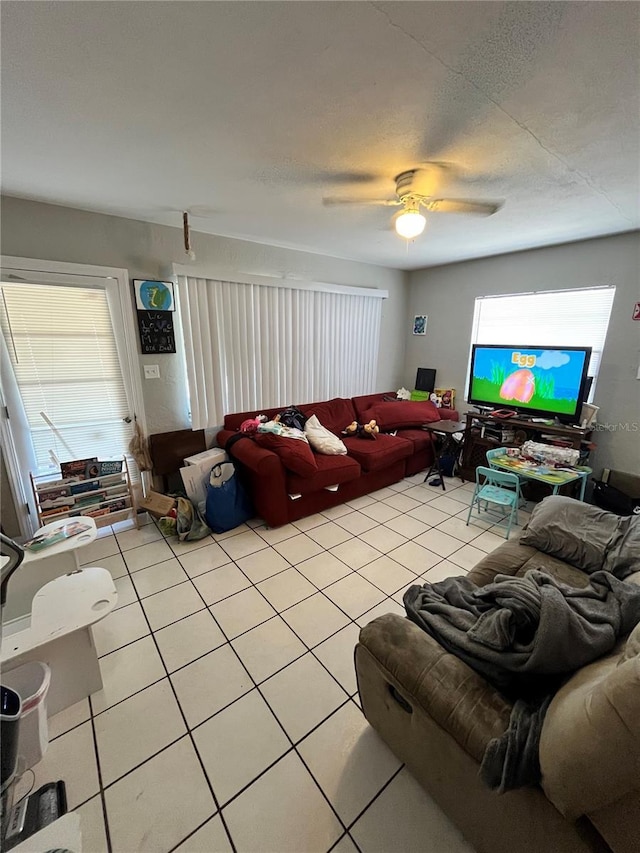 1708 28th St W, Bradenton, FL 34205 - living room featuring light tile patterned floors, ceiling fan, and plenty of natural light