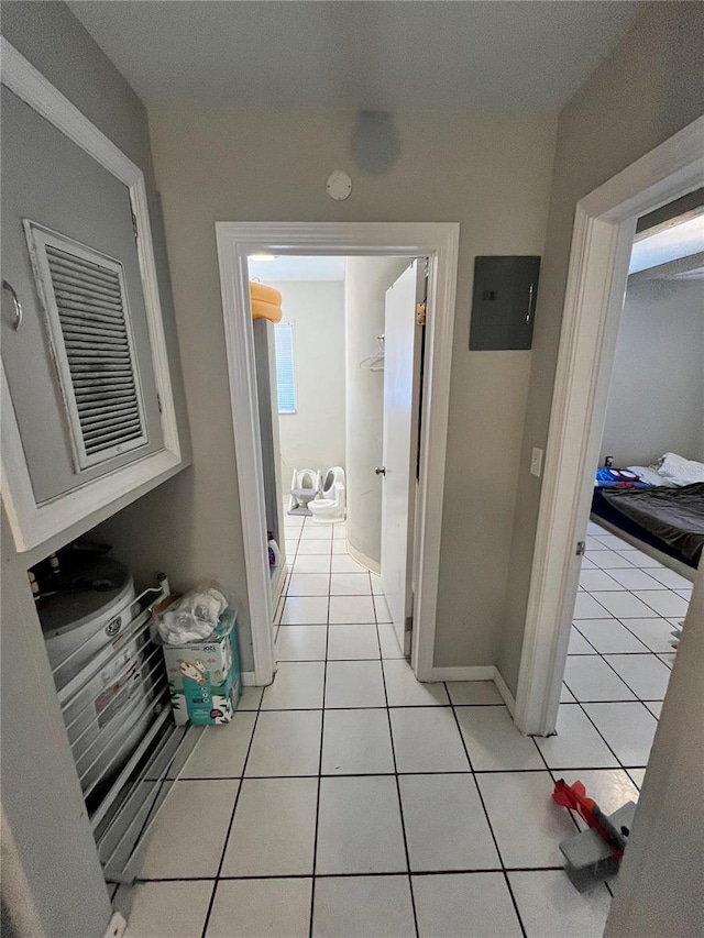 1708 28th St W, Bradenton, FL 34205 - hallway featuring electric panel, light tile patterned floors, and baseboards