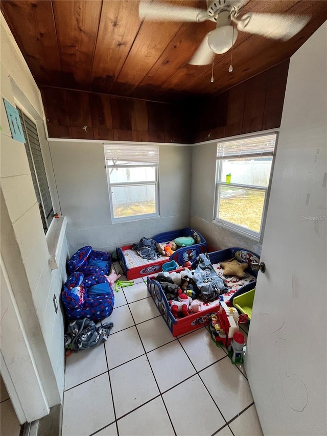 1708 28th St W, Bradenton, FL 34205 - bedroom with wood ceiling, tile patterned flooring, and multiple windows