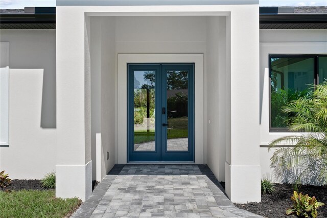 3344 Lagoy St, North Port, FL 34291 - entrance to property featuring french doors and stucco siding