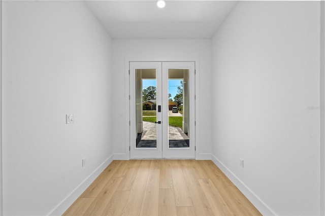 3344 Lagoy St, North Port, FL 34291 - doorway to outside with light wood-style floors, french doors, and baseboards