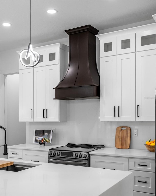 3344 Lagoy St, North Port, FL 34291 - kitchen featuring custom exhaust hood, a sink, stainless steel electric stove, light countertops, and pendant lighting
