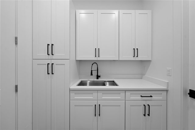 3344 Lagoy St, North Port, FL 34291 - kitchen featuring a sink, light countertops, and white cabinets