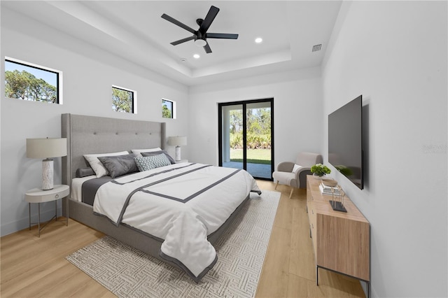 3344 Lagoy St, North Port, FL 34291 - bedroom with access to outside, light wood-style flooring, a tray ceiling, recessed lighting, and a ceiling fan