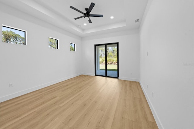 3344 Lagoy St, North Port, FL 34291 - spare room featuring light wood finished floors, recessed lighting, a tray ceiling, baseboards, and ceiling fan