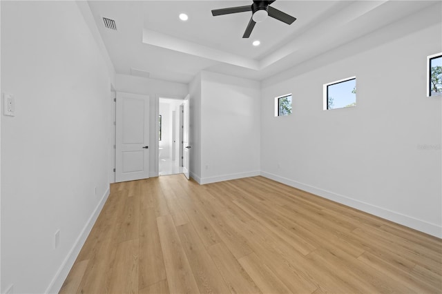 3344 Lagoy St, North Port, FL 34291 - spare room with a raised ceiling, light wood-style floors, plenty of natural light, baseboards, and recessed lighting