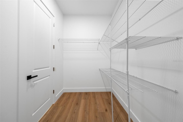 3344 Lagoy St, North Port, FL 34291 - walk in closet featuring wood finished floors