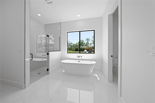 3344 Lagoy St, North Port, FL 34291 - bathroom featuring a shower stall, a freestanding tub, baseboards, toilet, and marble finish flooring