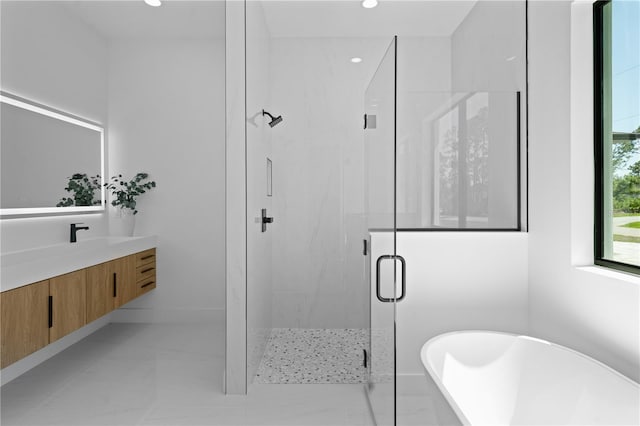 3344 Lagoy St, North Port, FL 34291 - full bathroom with a soaking tub, vanity, a marble finish shower, recessed lighting, and tile patterned flooring