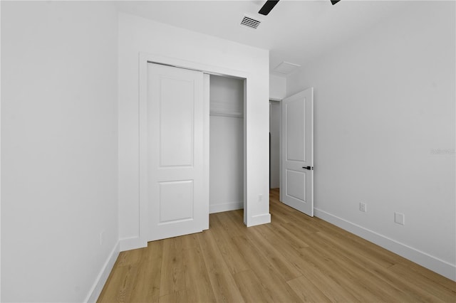 3344 Lagoy St, North Port, FL 34291 - unfurnished bedroom with light wood-type flooring, baseboards, a closet, and ceiling fan
