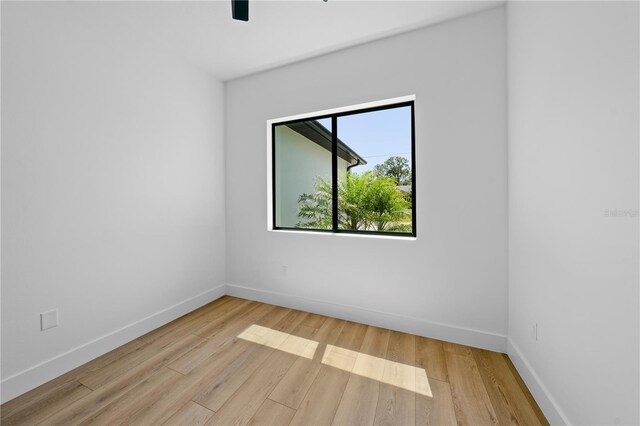 3344 Lagoy St, North Port, FL 34291 - unfurnished room featuring wood finished floors and baseboards