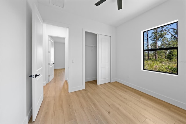 3344 Lagoy St, North Port, FL 34291 - unfurnished bedroom featuring light wood-type flooring, baseboards, a closet, and a ceiling fan