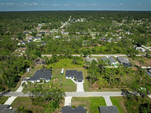 3344 Lagoy St, North Port, FL 34291 - aerial view of property and surrounding area featuring nearby suburban area and a heavily wooded area