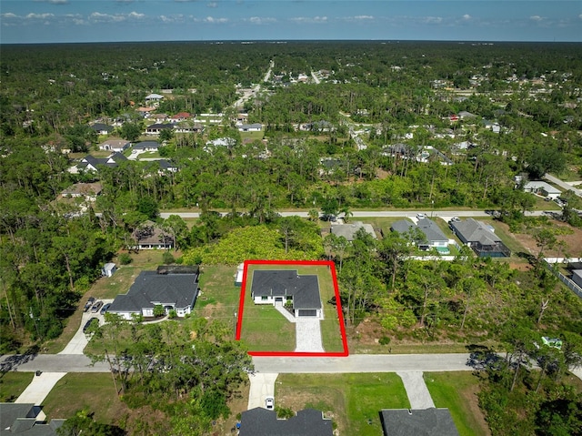 3344 Lagoy St, North Port, FL 34291 - aerial view of property and surrounding area with property parcel outlined, nearby suburban area, and a forest