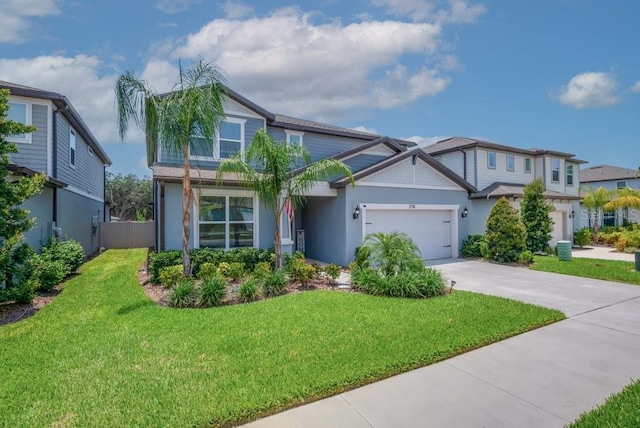2781 Dolores Home Ave, Valrico, FL 33594 - view of front of home with driveway, a front lawn, an attached garage, and stucco siding