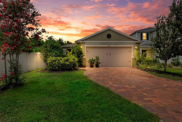 7302 Sunshine Bridge Ave, Gibsonton, FL 33534 - view of front of home with decorative driveway, a garage, and stucco siding