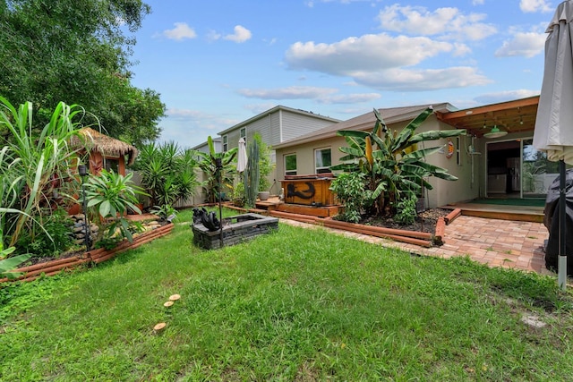 7302 Sunshine Bridge Ave, Gibsonton, FL 33534 - view of grassy yard featuring a garden