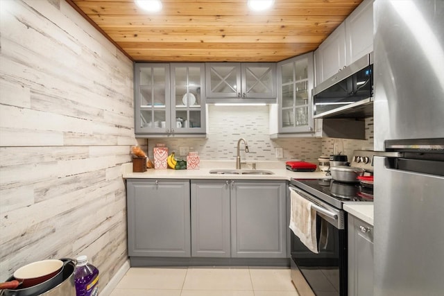 801 Russell Ln Unit 252, Brandon, FL 33510 - kitchen with gray cabinetry, appliances with stainless steel finishes, a sink, wooden ceiling, and light tile patterned floors