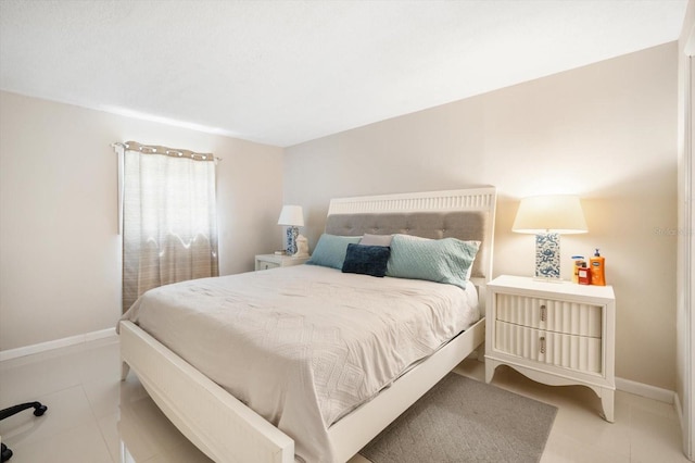 801 Russell Ln Unit 252, Brandon, FL 33510 - bedroom featuring baseboards and light tile patterned floors