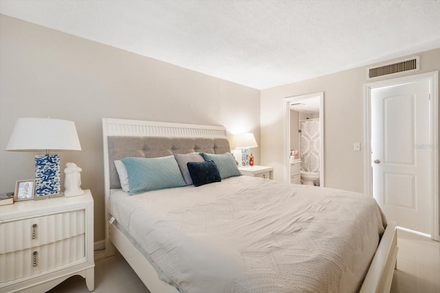 801 Russell Ln Unit 252, Brandon, FL 33510 - bedroom with tile patterned floors and connected bathroom