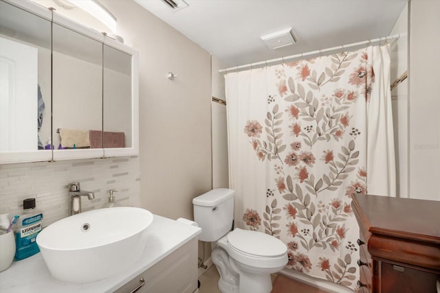 801 Russell Ln Unit 252, Brandon, FL 33510 - bathroom featuring decorative backsplash, toilet, vanity, and curtained shower