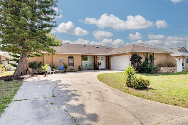 1913 Libby Ct, Holiday, FL 34690 - ranch-style home featuring stucco siding, driveway, a garage, and a front yard