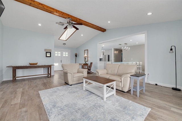 1913 Libby Ct, Holiday, FL 34690 - living room featuring light wood-style flooring, ceiling fan, recessed lighting, baseboards, and a chandelier