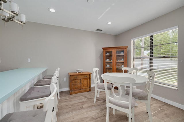 1913 Libby Ct, Holiday, FL 34690 - dining area featuring light wood-type flooring, baseboards, and recessed lighting