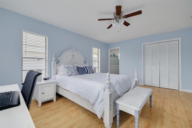 1913 Libby Ct, Holiday, FL 34690 - bedroom featuring light wood finished floors, a closet, a ceiling fan, and baseboards