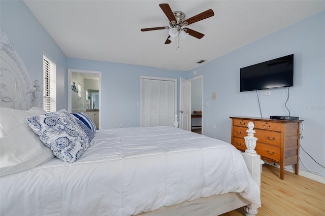 1913 Libby Ct, Holiday, FL 34690 - bedroom with wood finished floors, a closet, connected bathroom, a ceiling fan, and baseboards